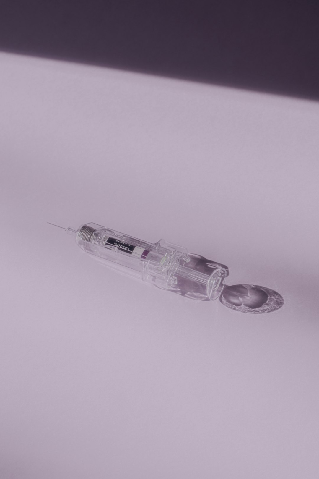 Two injectable medication vials and syringe supplies arranged for a peptide dosing protocol